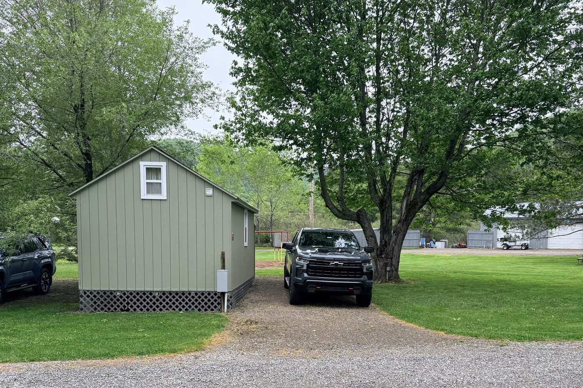 The small green cabin we stayed in at Allegheny River Campground, with Jim's truck parked beside it