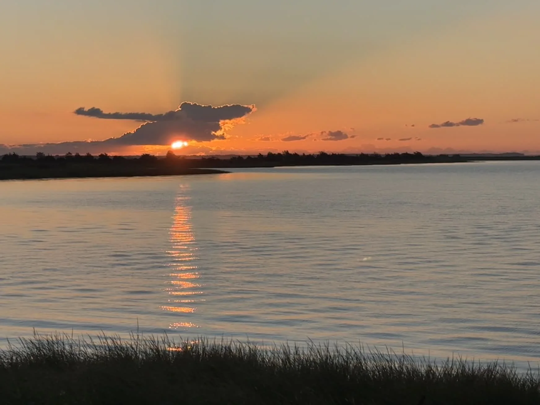 Sun setting across Delaware Bay in New Jersey, photographed by Jim