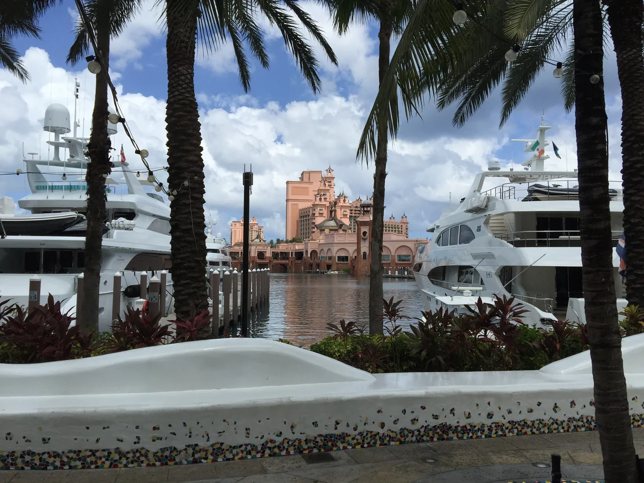 Palm trees, yachts and Atlantis buildings around the Paradise Island marina